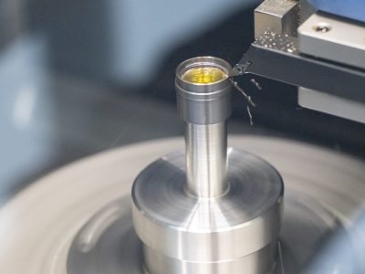 Mounted lens undergoing alignment turning at POG